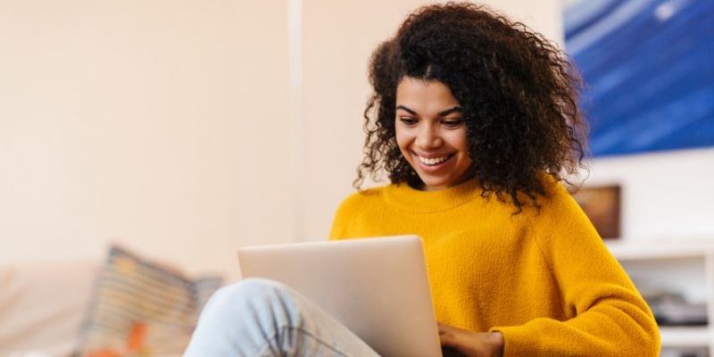 African American female researching on laptop computer