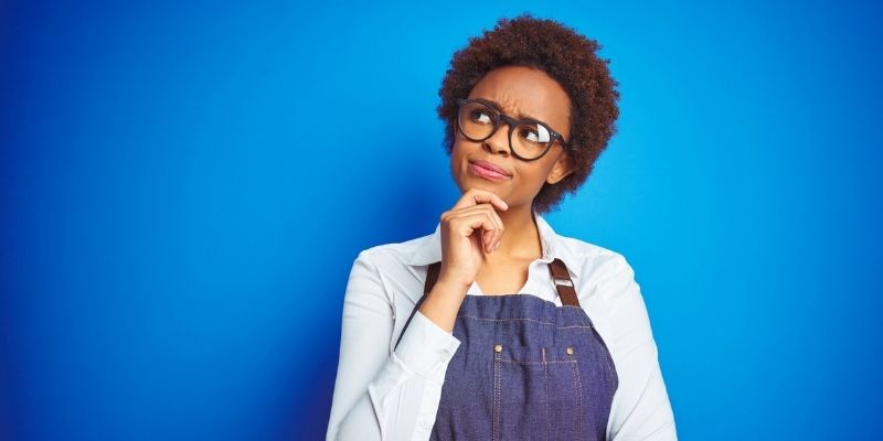 Female African American business owner considering pros and cons of alternative lending companies