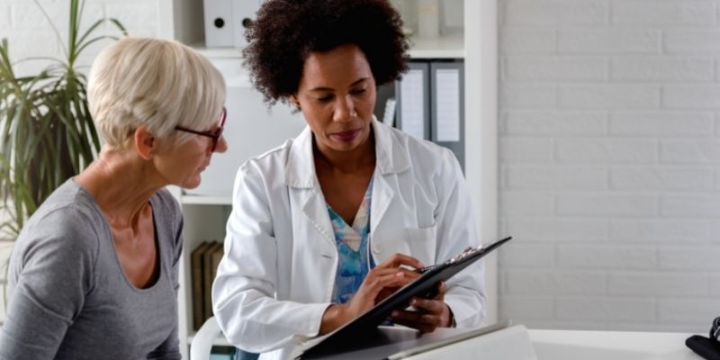 female doctor advising female patient in medical office