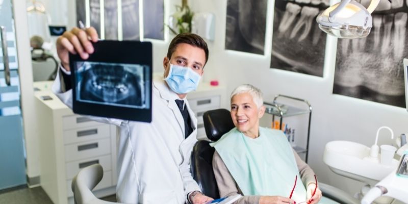 dentist showing xrays to client