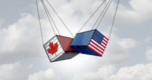 Trade conflict concept showing Canadian and U.S. cargo containers in collision