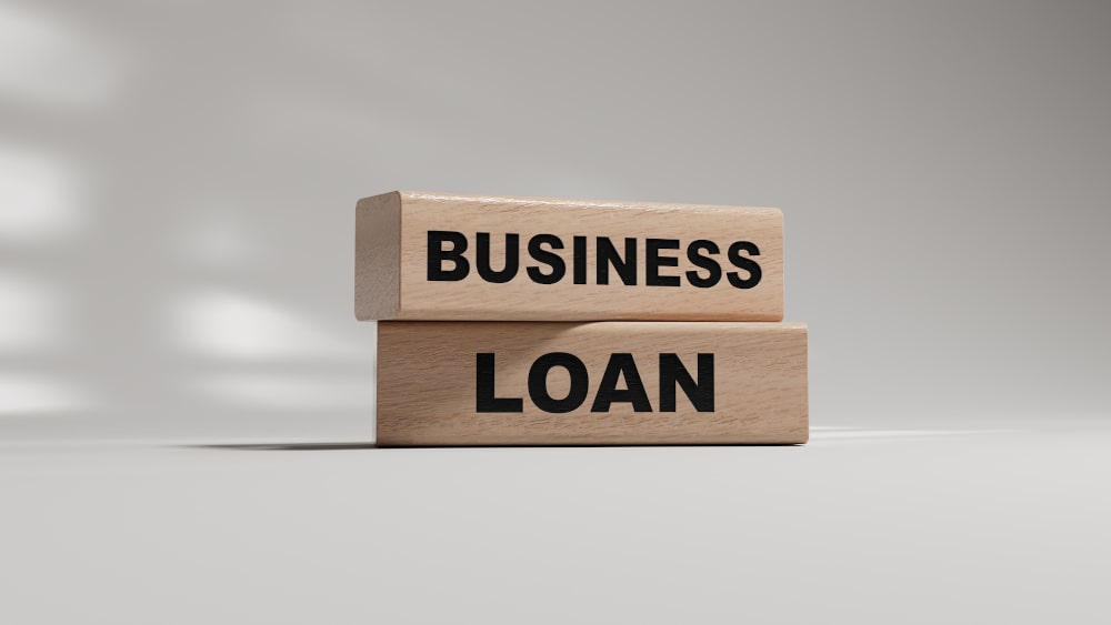 How to Get a Business Loan in Canada: Concept words 'business loan' on wooden blocks