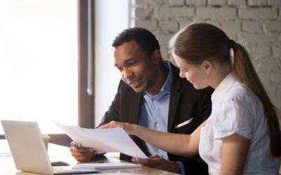 How to Read and Compare Business Loan Offers: Female financial advisor insurer consulting male african-american client about business loan offer