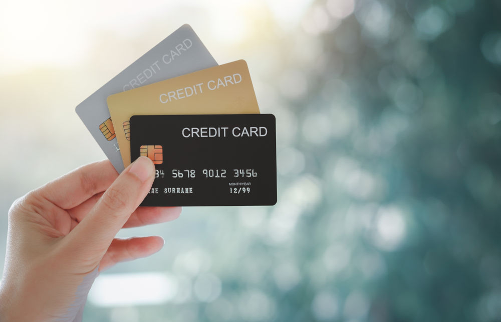 Business Line of Credit vs Credit Card for Canadian Business Owners Business owner comparing a line of credit and a credit card to manage cash flow and business expenses
