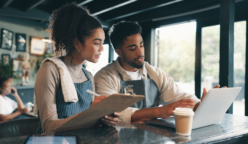 Restaurant Working Capital and Cash Flow Management Guide Restaurant owner reviewing cash flow and working capital to manage daily business expenses in Canada